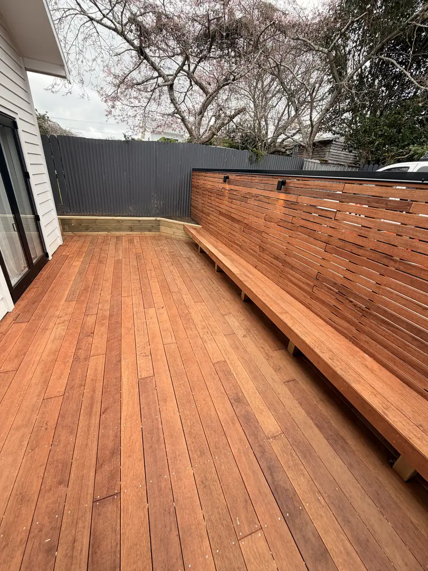 Timber deck with a long built-in bench and slatted screen