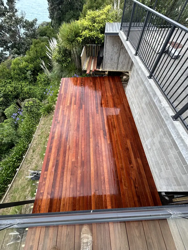 Timber deck with a balustrade beside native bush