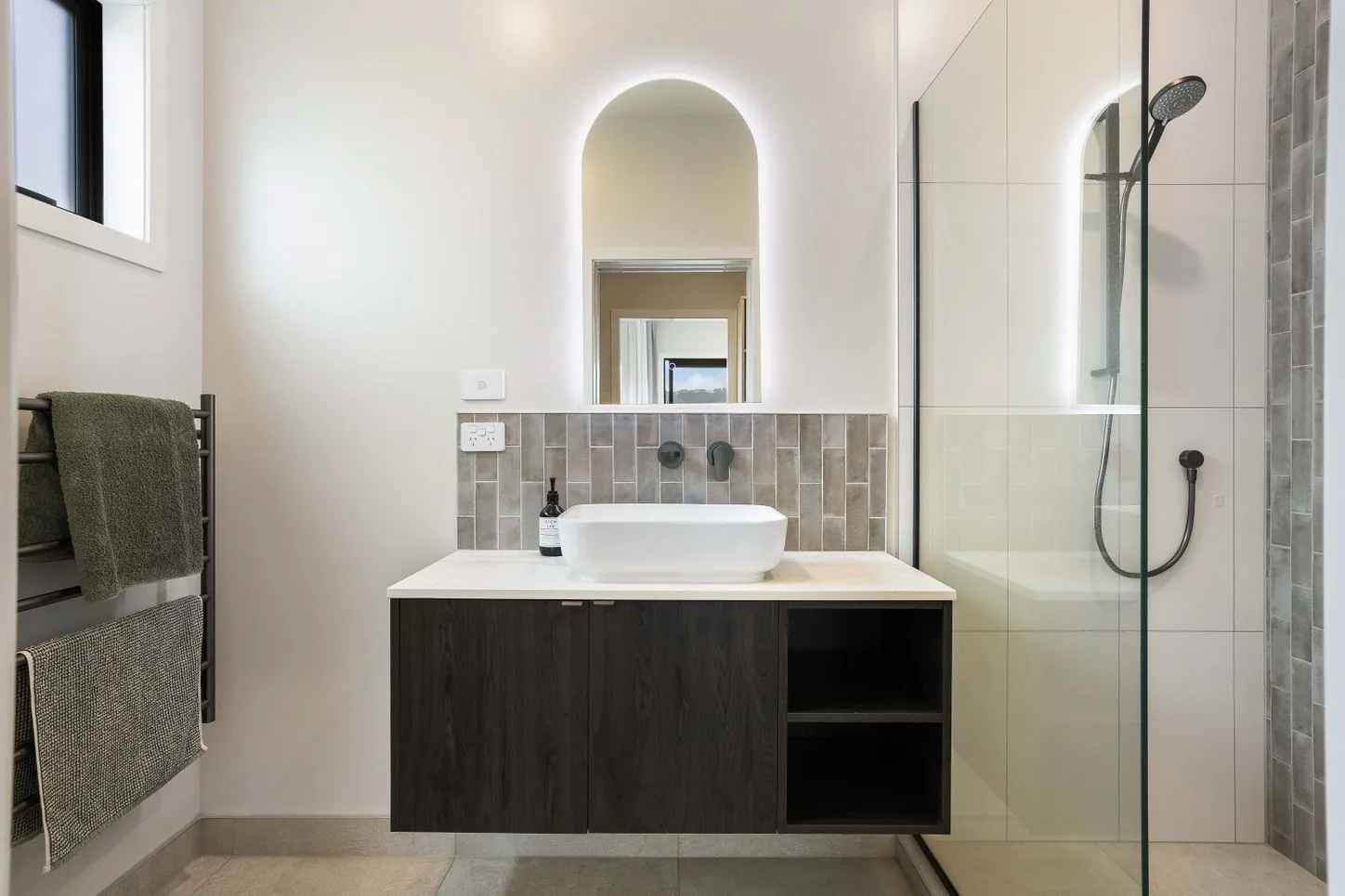 Bathroom vanity with a towel rail