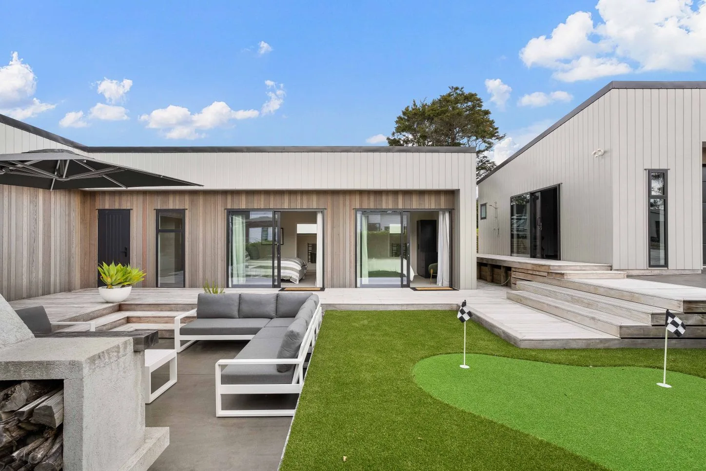 Courtyard with a putting green and outdoor lounge