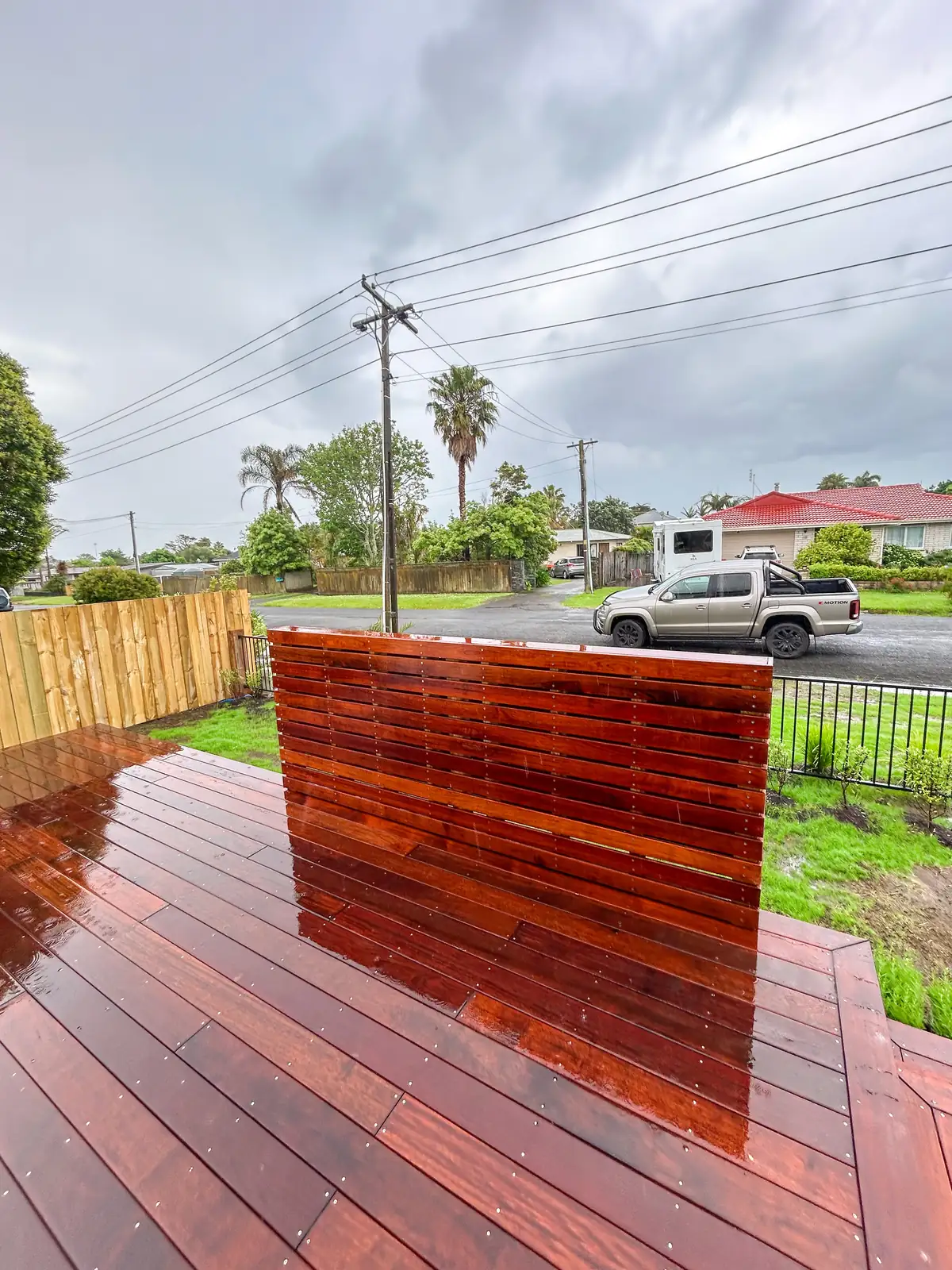 Timber deck with a slat screen in the corner